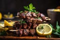 stack of grilled beef shishkabob with slice of lemon and sprigs of fresh herbs