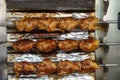 A stack of grilled chicken on a skewer fried