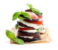 Stack of grilled eggplant with tomato and mozzarella isolated on white Royalty Free Stock Photo