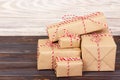 Stack of handcraft gift boxes on wooden board with a natural textured background Royalty Free Stock Photo