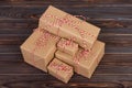 Stack of handcraft gift boxes on wooden board with a natural textured background Royalty Free Stock Photo