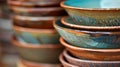 Stack of handmade ceramic bowls displaying earthy tones and textures Royalty Free Stock Photo