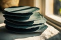 Stack of Handmade Paper Discs Near Window with Sunlight and Shadow Royalty Free Stock Photo