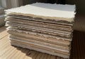 A stack of handmade paper is neatly arranged, with each sheet Royalty Free Stock Photo