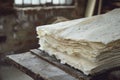 Stack of handmade paper sheets with natural imperfections