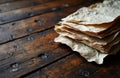 Stack of handmade paper sheets on rustic wooden table with rich texture Royalty Free Stock Photo