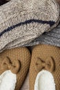 Stack of Handmade Warm Knitted Socks From Rough Wool Yarn Fluffy Fir Slippers Top View. Winter Autumn Eco Fashion Kinfolk