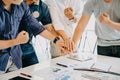 Stack of hands Unity and teamwork concept; Business people putting their hands together on office desk Royalty Free Stock Photo