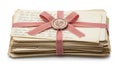 Stack of handwritten letters tied with a bow isolated on white background Royalty Free Stock Photo