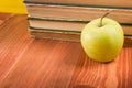 Stack of hardback books, diary on wooden deck table and yellow background. Back to school. Copy Space. Education Royalty Free Stock Photo