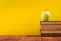 Stack of hardback books, diary on wooden deck table and yellow background. Back to school. Copy Space. Education Royalty Free Stock Photo