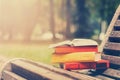 Stack of hardback books and Open book lying on