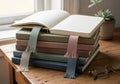 A stack of hardcover journals with lined pages and fabric bookmarks is arranged neatly on a wooden Royalty Free Stock Photo