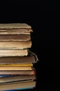 Stack of hardcover old books with on a dark background. Bookshelf shop, Knowledge publications, literature. Bookish bookstore