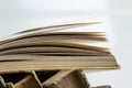 Stack of hardcover old books with an open book on white background. Bookshelf shop, Knowledge publications, literature. Bookish