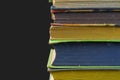 Stack of hardcover vintage books isolated with copy space. Black background Royalty Free Stock Photo