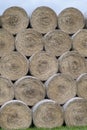 Stack of hay balls, haystack or haycock on an agricultural field. Large rolls of straw on a farm