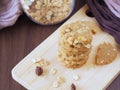 Stack healthy homemade oat cookies on wooden boards.