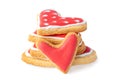 Stack of heart shaped biscuits with sugar icing isolated on white Royalty Free Stock Photo