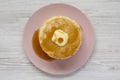 Stack of homemade pancakes with butter and maple syrup on a pink plate, overhead view. Top view, from above, flat lay. Close-up Royalty Free Stock Photo