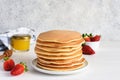 Stack of honey pancakes, homemade strawberry pancakes