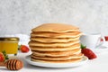 Stack of honey pancakes, homemade strawberry pancakes