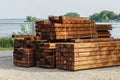 A stack of impregnated timber ready for the construction of a wooden house
