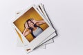 Stack Of Instant Film Photos From Modeling Casting In Studio With Shot Of Young Woman On Top