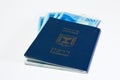 Stack of israeli money bills of 200 shekel and israeli passport Royalty Free Stock Photo