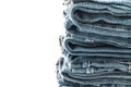 stack of jeans folded on white background Royalty Free Stock Photo