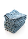 stack of jeans folded on white background Royalty Free Stock Photo