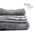 Stack of jeans trousers isolated Royalty Free Stock Photo