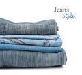 Stack of jeans trousers isolated Royalty Free Stock Photo