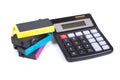 Stack of jet-ink printer cartridges and calc Royalty Free Stock Photo