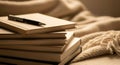 Stack of journals with pen on top, blurred cozy blanket in background, symbolic self-reflection Royalty Free Stock Photo