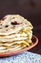 Stack of Khychin - traditional flatbreads stuffed with mashed potatoes and greens served on a plate Royalty Free Stock Photo