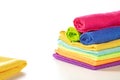 Stack of kitchen microfiber towels in bright colors on a white background