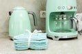 Stack of kitchen towels, a coffee maker and an electric kettle in the kitchen interior Royalty Free Stock Photo