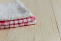 Stack of kitchen towels on light wooden background Royalty Free Stock Photo