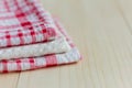 Stack of kitchen towels on light wooden background Royalty Free Stock Photo