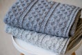 A stack of knitted handmade plaids Royalty Free Stock Photo