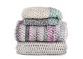 Stack of knitted scarfs isolated on white background Royalty Free Stock Photo
