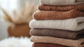 Stack of Knitted Sweaters in Neutral Colors Royalty Free Stock Photo