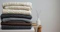 Stack of Knitted Sweaters in Neutral Colors Royalty Free Stock Photo