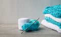 A stack of knitted things and balls of cotton for knitting Royalty Free Stock Photo