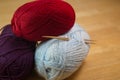 Stack of knitting yarn skeins with needles