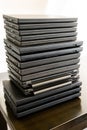 Stack of laptop computers: Laptops are used and second hand, might be for people in need due to working from home or