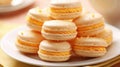 Stack of lemon macarons on a white plate Creamsicle Macaroons Royalty Free Stock Photo