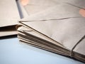 A stack of letters in Kraft envelopes lies on the table Royalty Free Stock Photo