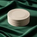 A stack of light beige round coasters with concentric circle patterns on top. They are Royalty Free Stock Photo